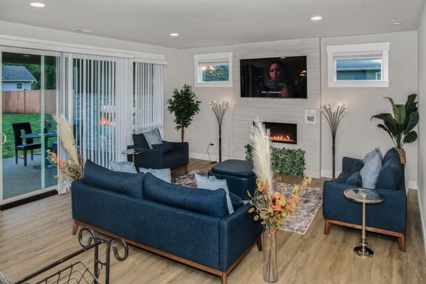 Bright living room with modern furniture and a TV