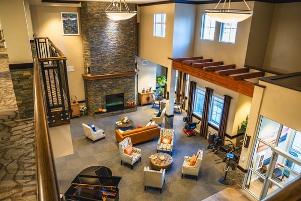 Spacious common area with seating and a fireplace