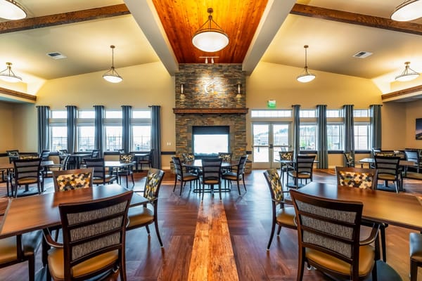 Interior view of a dining room with tables and chairs