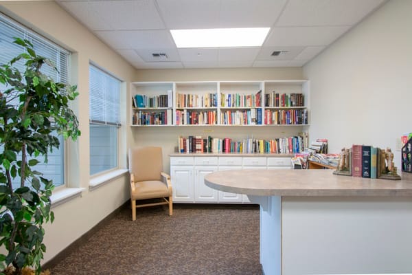 Cozy reading area with bookshelves and armchair