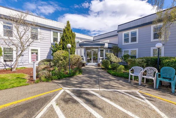 Entrance to Marine Plaza with greenery and benches