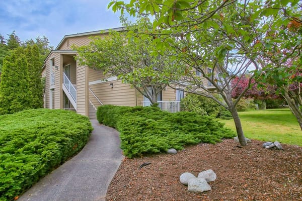 Exterior view of the building with landscaped walkway
