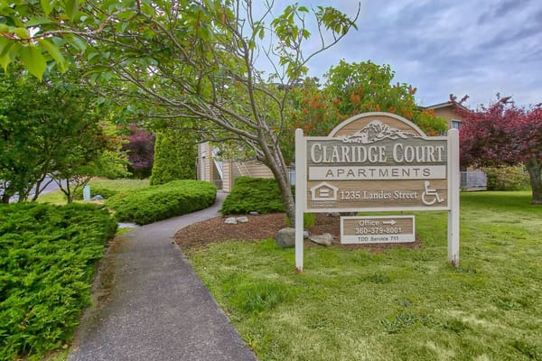 Exterior view of Claridge Court sign and landscaping