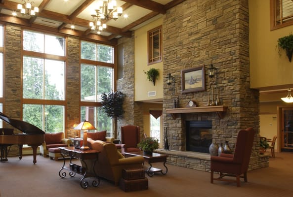 Cozy common area with stone fireplace and large windows