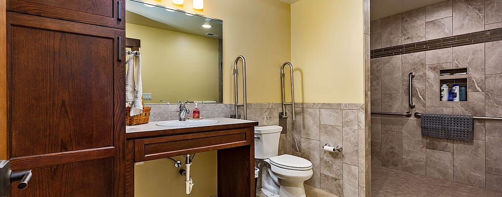 Accessible bathroom with grab bars and modern fixtures