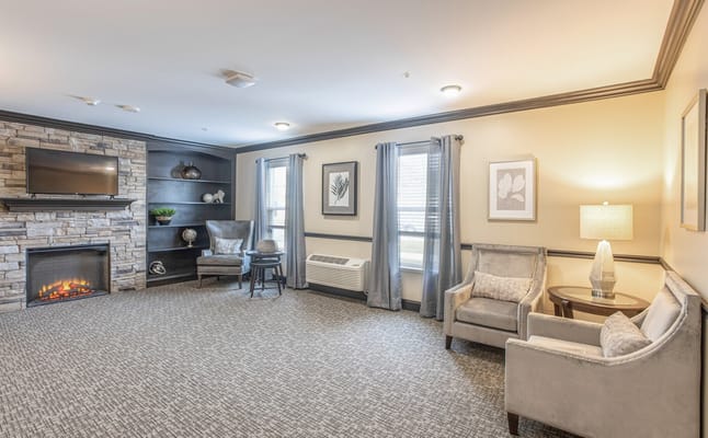 Stylish living room with stone fireplace and comfortable seating
