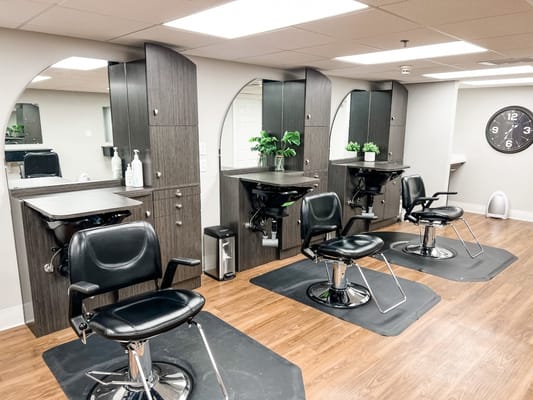 Interior view of the salon with styling stations and chairs
