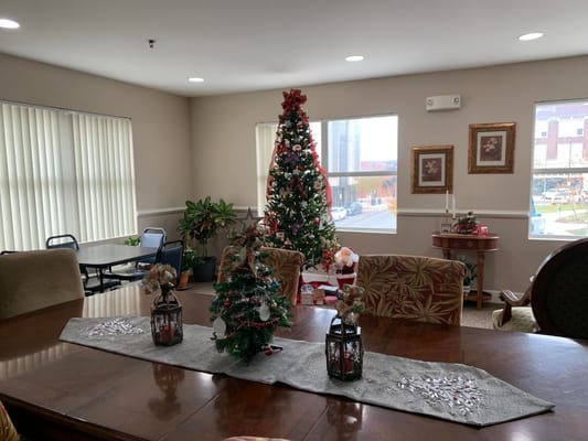 Festively decorated common area with Christmas tree