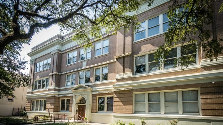 Exterior view of the nursing home building with trees