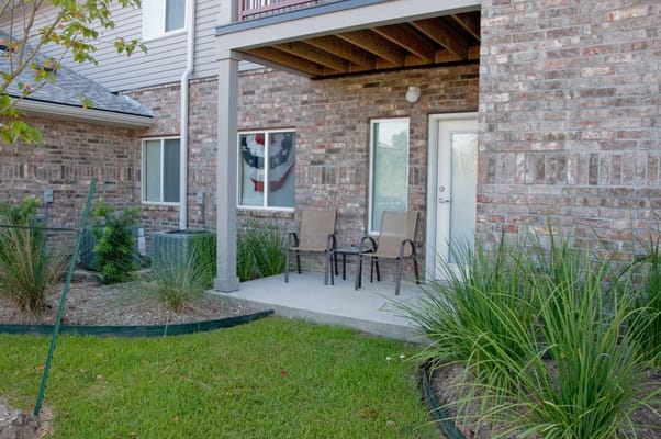 Patio area with chairs and landscaping
