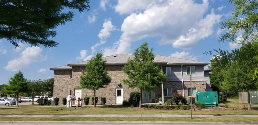 Exterior view of Hooper Springs facility surrounded by trees