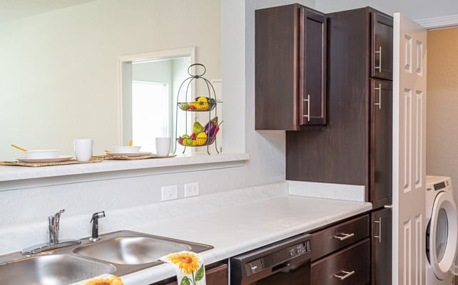 Stylish kitchen with marble countertop and fruit display