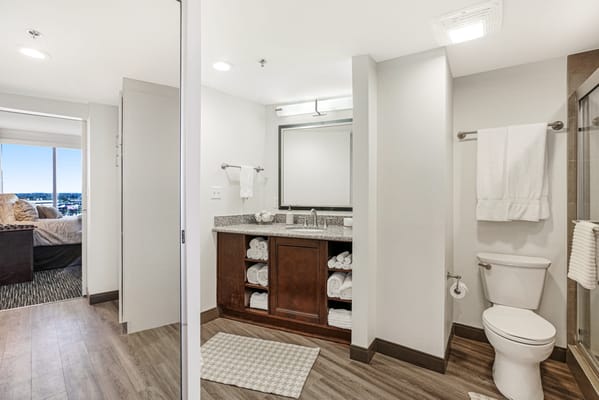 A well-lit bathroom with modern amenities and a spacious layout
