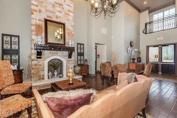 Interior view of the lobby with seating and a fireplace