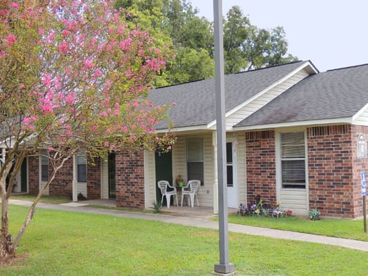 Exterior view of a resident building with flowers