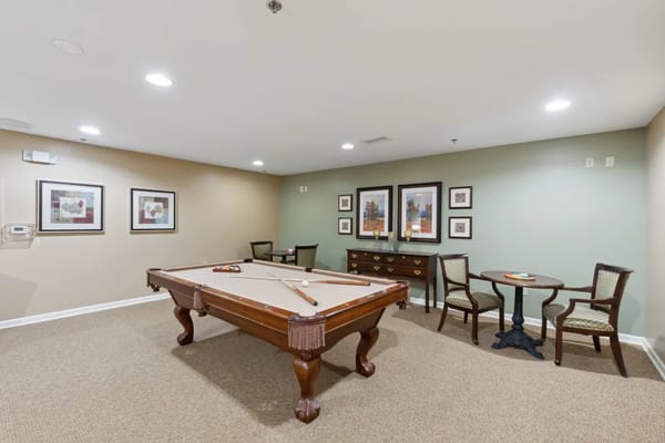 Common area with a pool table and seating