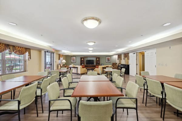 Interior view of a dining room with tables and chairs