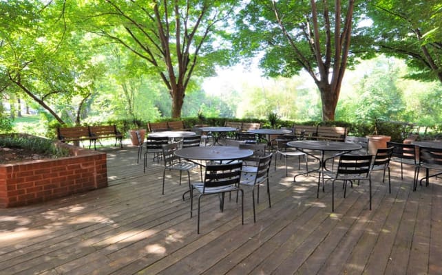 Outdoor seating area with tables and chairs