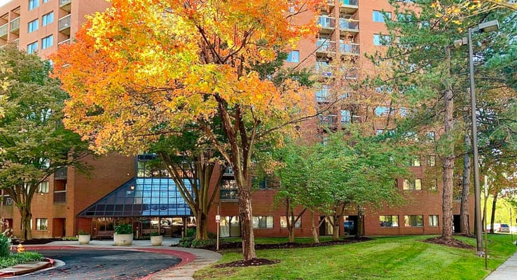 Exterior view of Owen Brown Place Apartments in autumn