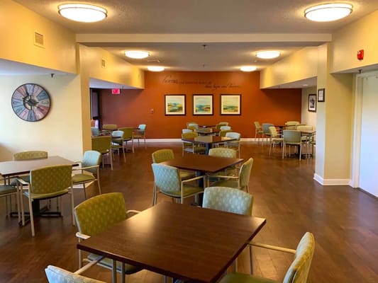 Interior view of a dining area with tables and chairs