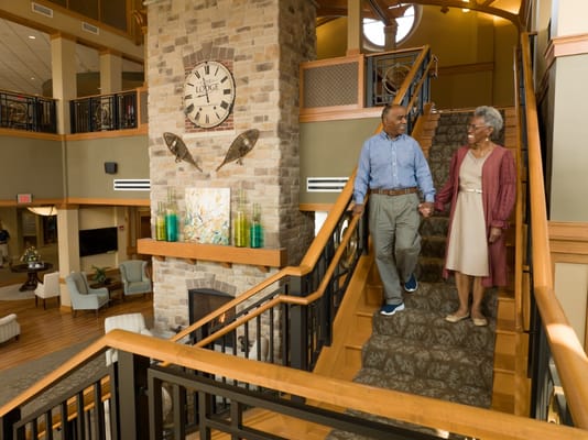 Residents walking together in a welcoming interior space