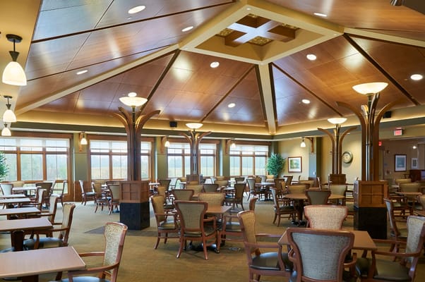 Spacious dining room with tables and chairs at The Lodge at Willow Ponds.