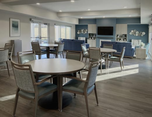 Bright common area with seating and TV