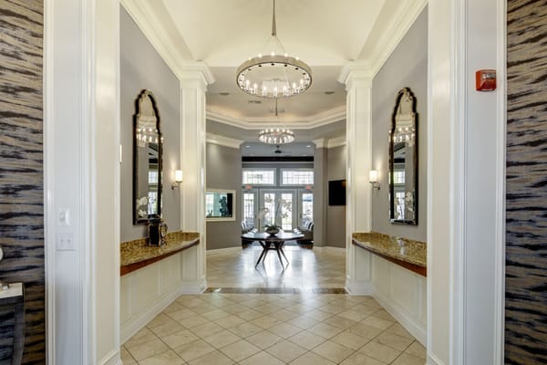 Interior view of the lobby showcasing chandeliers and mirrors