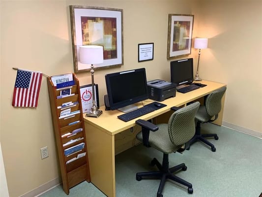 Computers set up in a cozy corner of a facility