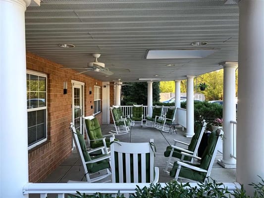 Outdoor seating area with rocking chairs