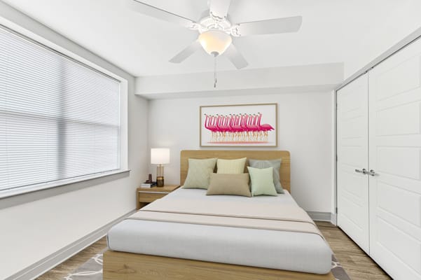 A well-decorated bedroom with a bed and colorful pillows.