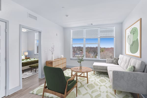 Bright and inviting living room with a view in Seneca Creek Senior Living.