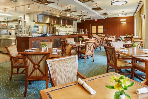 Bright dining room with wooden tables and chairs
