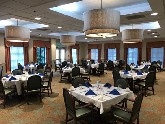 Dining room setup with tables and chairs