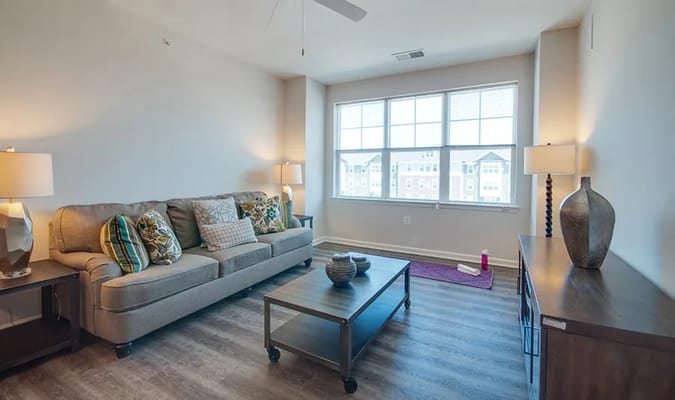 Cozy living room with modern furnishings and large windows