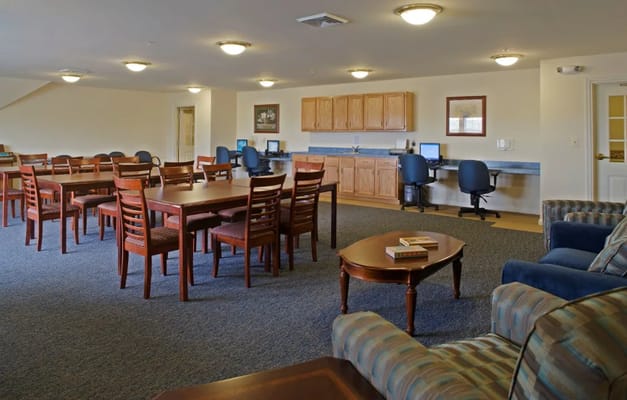 Common area with tables and seating for residents