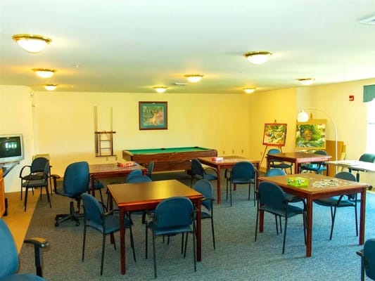 Interior common area with tables and a pool table