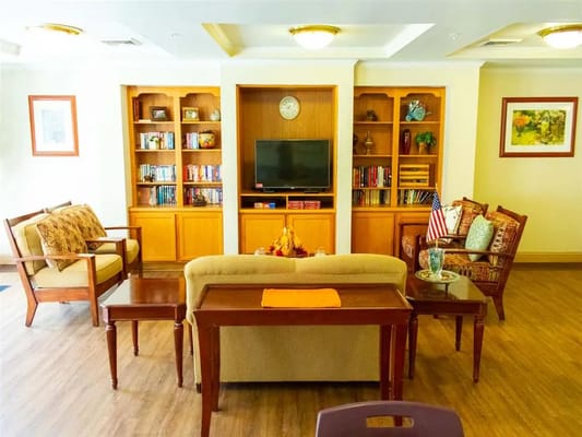 Common area with seating and bookshelf