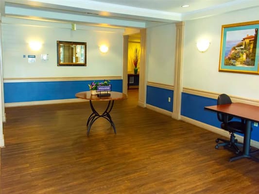 Interior view of a reception area with a table and chairs