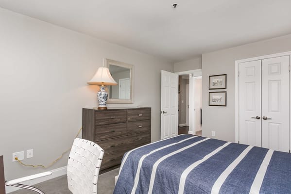 Cozy resident room with a bed and dresser