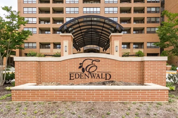 Edenwald facility logo on a brick sign