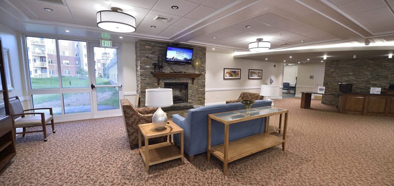 Cozy common area with seating and a fireplace