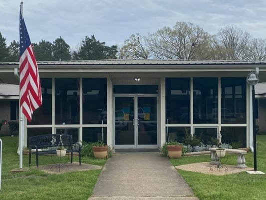 Front entrance of Presbyterian Village of Homer with landscaping