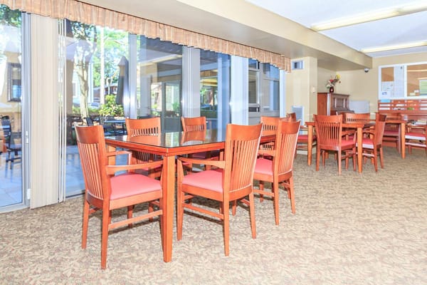 Cozy dining area with wooden tables and chairs