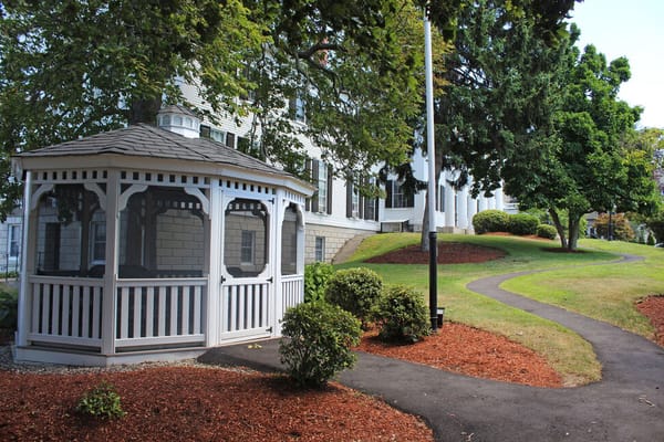 Outdoor gazebo surrounded by landscaped grounds