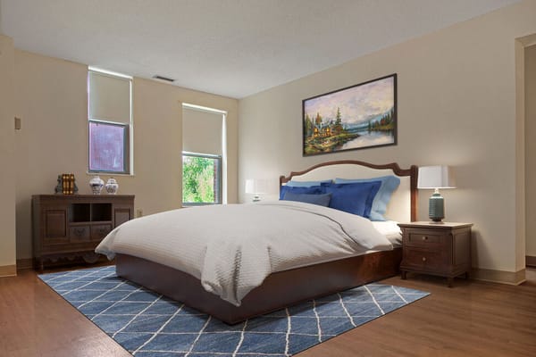 Cozy bedroom with a painting and modern furnishings