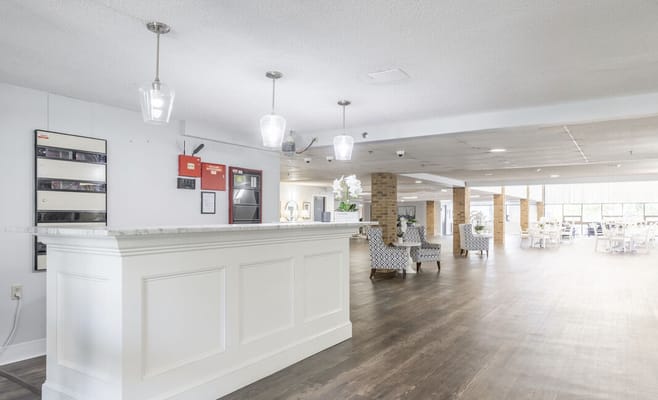 Bright lobby area with seating and reception desk