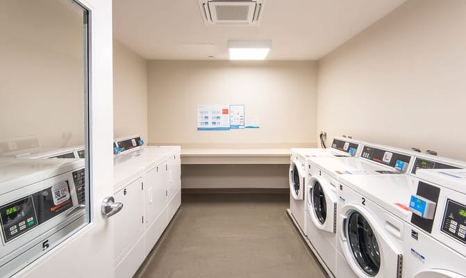 Modern laundry room with washers and dryers