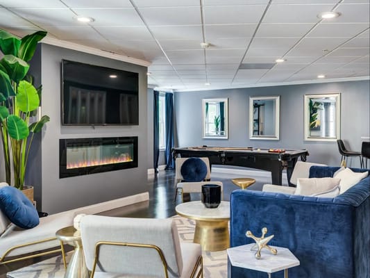 Cozy common area with seating and a fireplace