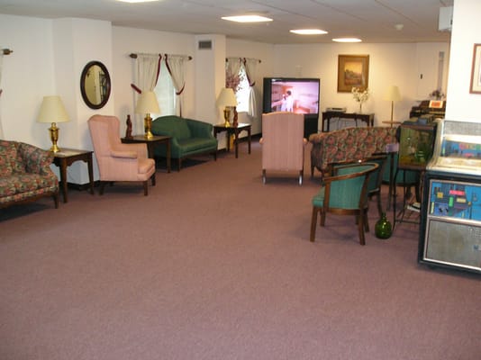 Interior of a common area with seating and a TV